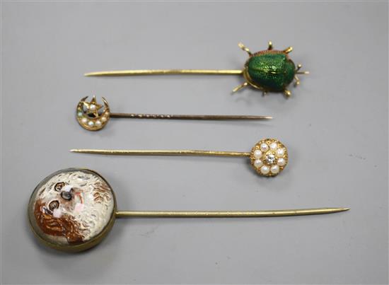 A yellow metal and scarab set stick, three others including Essex crystal style, pearl and pearl and diamond, largest 82mm.